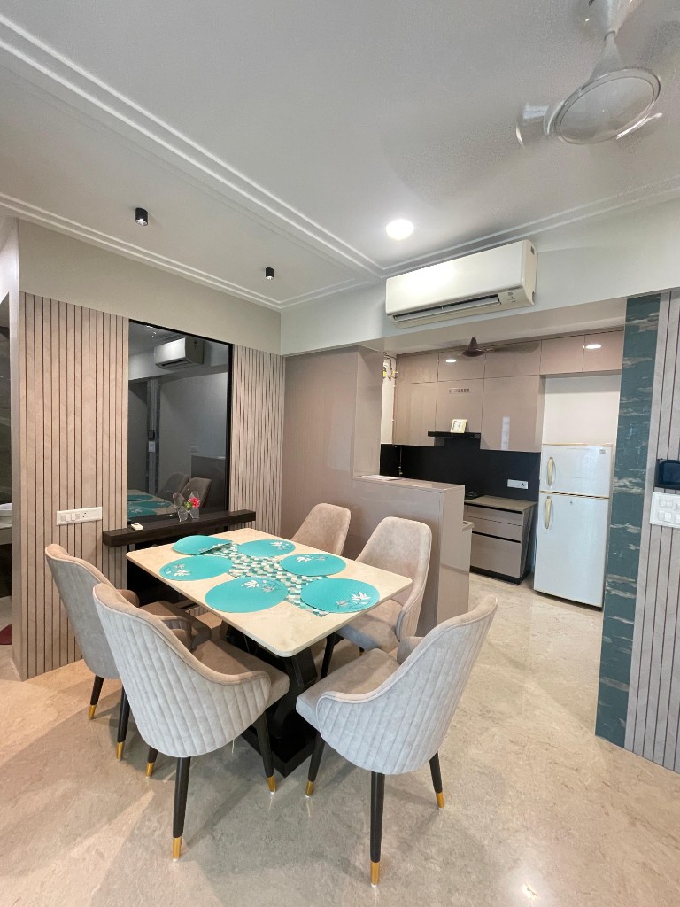 Dining table and modern kitchen in background